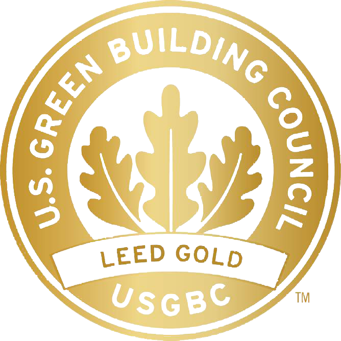 Gold seal logo for the U.S. Green Building Council with a central white oak leaf design. The text reads "LEED Gold."